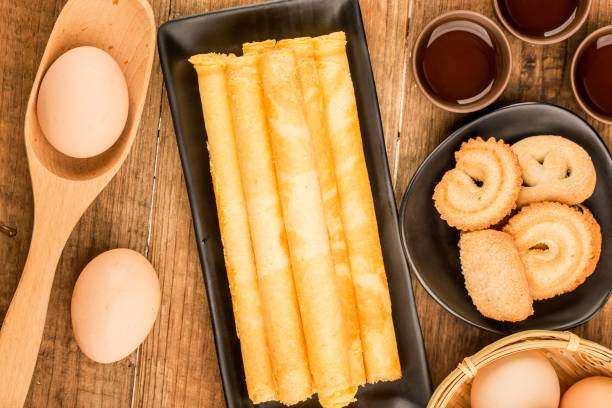 Egg roll biscuit on plate stock photo