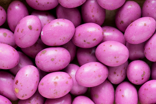 Egg stone bean balls chocolate textured background