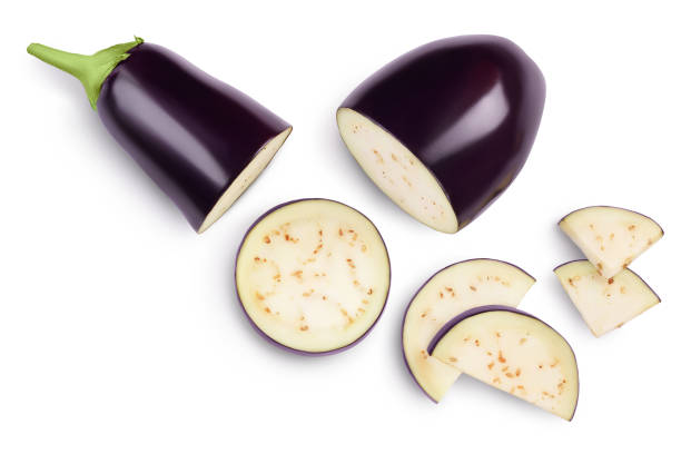 Eggplant or aubergine with slices isolated on white background. Clipping path and full depth of field. top, view, flat lay Eggplant or aubergine with slices isolated on white background. Clipping path and full depth of field. top, view, flat lay. eggplant stock pictures, royalty-free photos & images