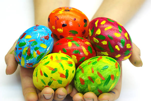 Eggs and hands  easter sunday stock pictures, royalty-free photos & images