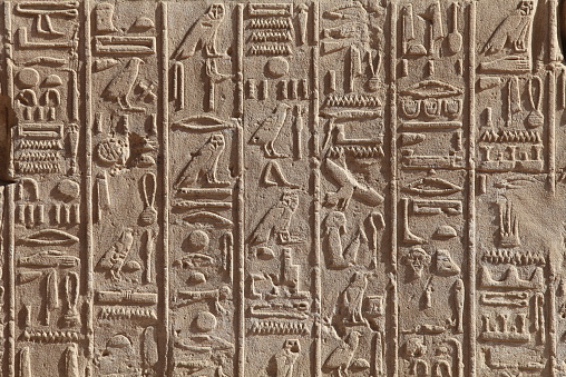 Egyptian hieroglyphics on the stone wall