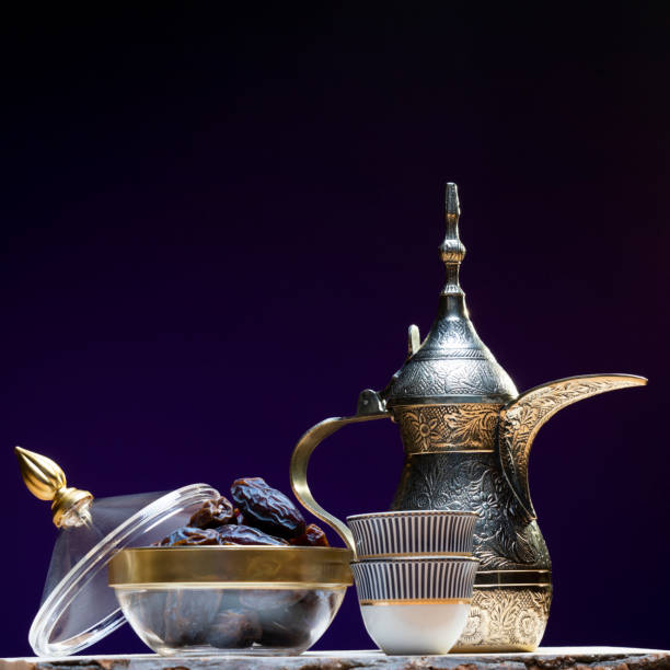 Eid and Ramadan set with Arabian coffee and dates set in dark background Eid and Ramadan set with Arabian coffee and dates set in dark background. Festive greeting card, an invitation for Muslim holy month Ramadan Kareem or Eid al Adha and Eid al fiter middle eastern culture stock pictures, royalty-free photos & images