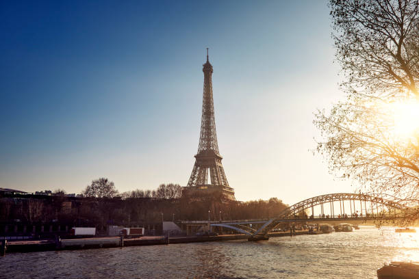 Eiffel Tower and the river seine with low sun stock photo