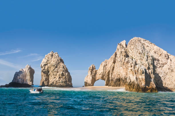 El Arco, at Land's End, Cabo San Lucas. Giant rocky outcrops featuring a natural arch, are one of the most famous natural attractions of Mexico. stock photo