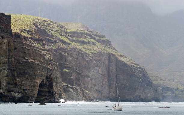 El Dedo de Dios - rock near the coast bay near the town Agaete in the island of Gran Canaria stock photo