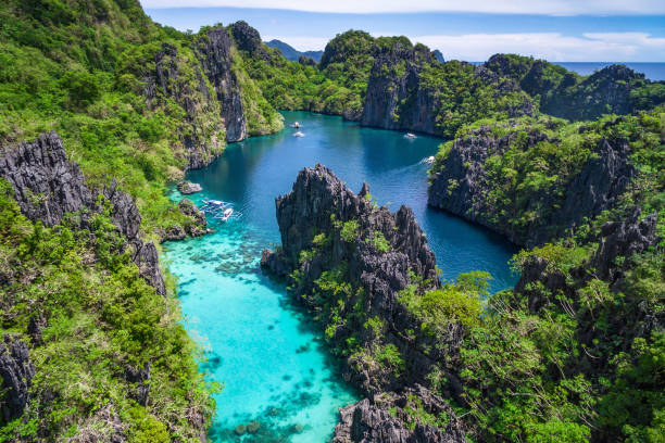 El Nido, Palawan, Philippines, Aerial View of Beautiful Lagoon and Limestone Cliffs El Nido, Palawan, Philippines, aerial view of beautiful lagoon in the Bacuit archipelago. philippines stock pictures, royalty-free photos & images