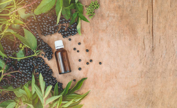 elderberry syrup immunity boosting for flu season. elder, black elder. - boosting imagens e fotografias de stock
