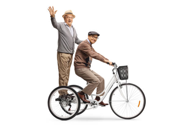 Elderly men riding a tricycle and waving at the camera Elderly men riding a tricycle and waving at the camera isolated on white background adult tricycle stock pictures, royalty-free photos & images