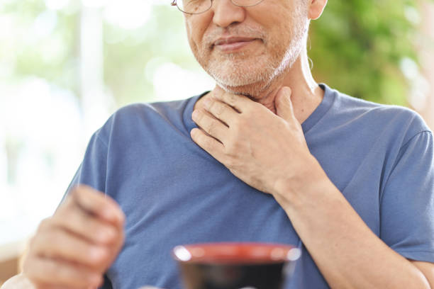 elderly people with dysphagia - choking stockfoto's en -beelden