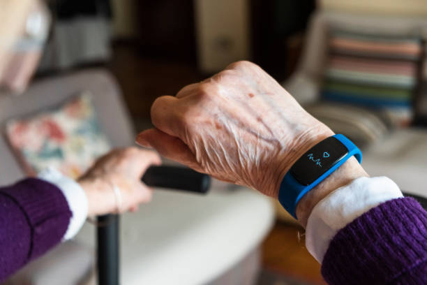 Elderly woman hand and detail of the smartwatch stock photo