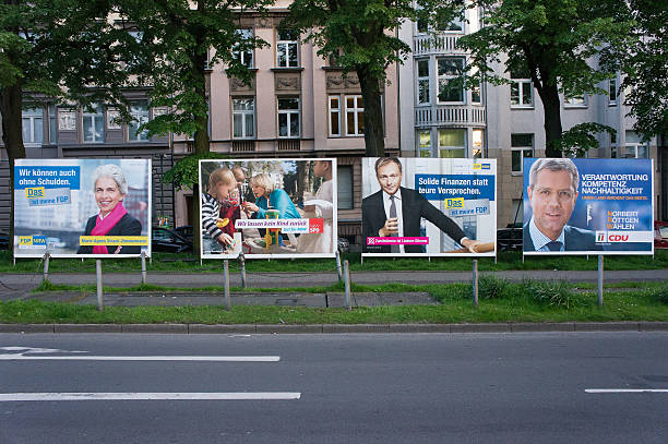 Election posters (Wahlkampfplakate) in North Rhine Westfalia "Duesseldorf, Germany - May 7, 2012: Large billboards for the elections held earlier in 2012 in Germany's most populated state North Rhine Westfalia - the billboards showing the leading candidates and messages of three of the most popular parties: CDU, SPD and FDP" german social democratic party stock pictures, royalty-free photos & images