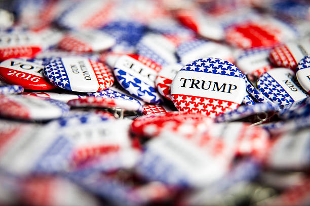 Election Vote Buttons La Habra, United States - July 8, 2016: Close up of Vote election buttons, with red, white, blue and stars and stripes. Donald Trump is the republican candidate for president in the United States donald trump stock pictures, royalty-free photos & images