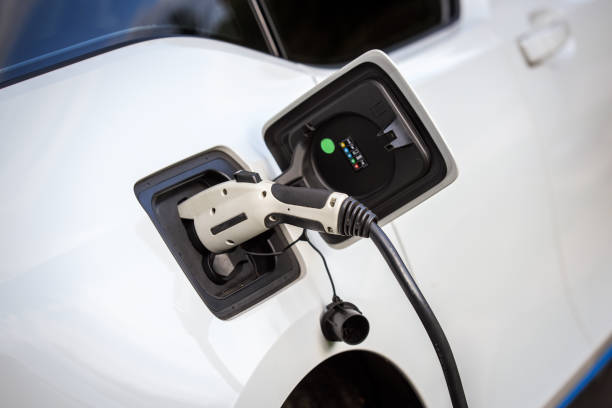 Electric car charging - electric mobility - automotive industry stock photo
