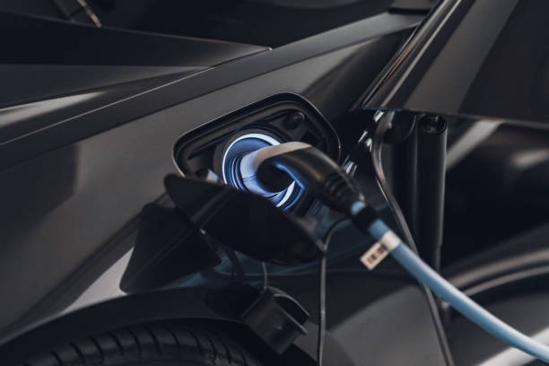 electric car charging - car charger imagens e fotografias de stock