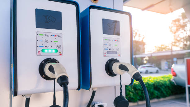 Electric car charging station for charge EV battery. Plug for vehicle with electric and hybrid engine. EV charger. Clean energy. Charging point for EV car. Green power . Future transport technology. stock photo