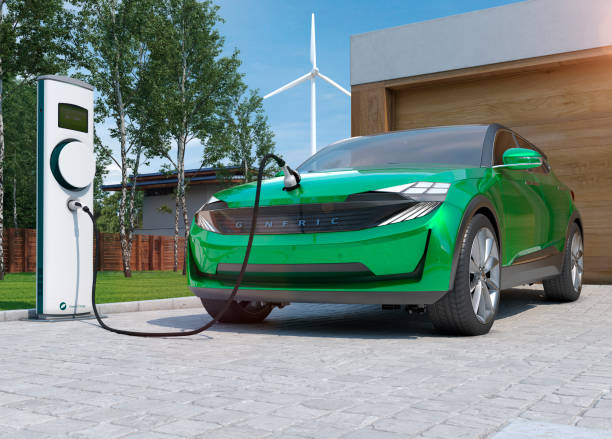 electric car suv charging at home in front of modern low energy suburban house - car charger imagens e fotografias de stock