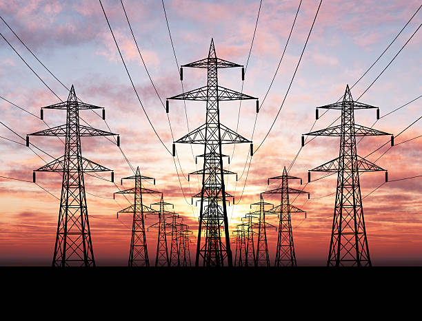 Electric Pylons Electric power lines over sunrise electricity pylon photos stock pictures, royalty-free photos & images