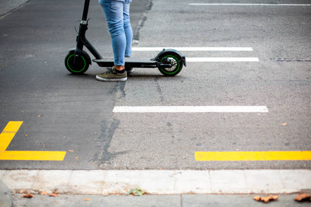 Electric scooter standing on the road stock photo