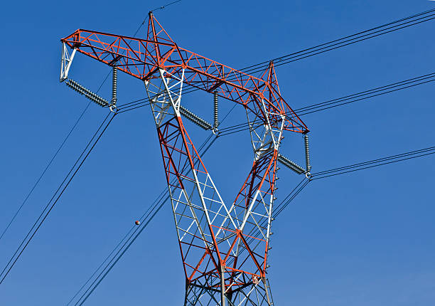 Electricity pylon, horizontal Electricity red and white pylon against a blue sky. Horizontal. buzbuzzer energy cable steel cable stock pictures, royalty-free photos & images
