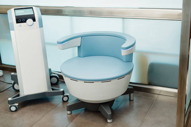 Electromagnetic chair for urinary incontinence treatment at medical clinic. Electromagnetic chair for stimulation of deep pelvic floor muscles and restoring neuromuscular control at the clinic. pelvic floor stock pictures, royalty-free photos & images