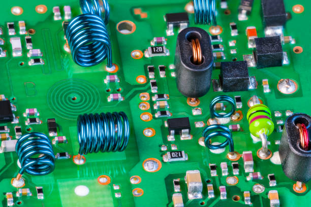 Electronic components to receiving radio-frequency signal on green printed circuit board stock photo