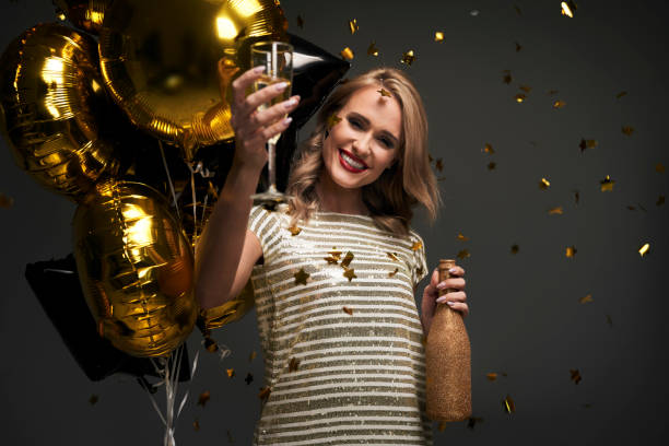 Elegance woman celebrating the New Year's Eve stock photo