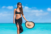 istock Elegant black bikini woman with hat sunglasses 1331377548