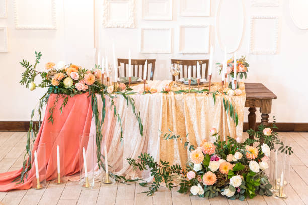 Elegant decor of a wedding bank in peach and green stock photo