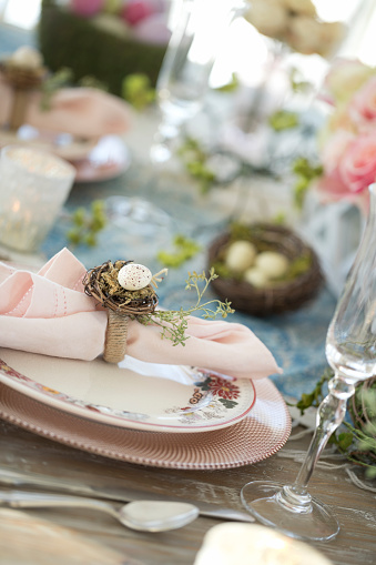 Elegant Easter Dining Table in Pink and Blue with a Centerpiece of Roses
