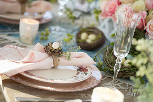 Elegant Easter Dining Table in Pink and Blue with a Centerpiece of Roses