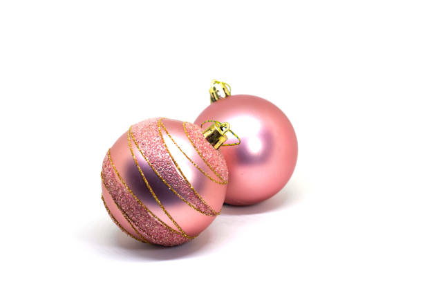 Elegant pink baubles for Christmas tree isolated on white background. Christmas ball studio clip art. Pink firtree ornament for Christmas greeting card or mockup. Pink firtree bauble decoration stock photo