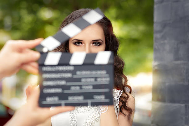 Elegant Woman Ready for a Shoot Young actress ready to film a new scene  clapboard photos stock pictures, royalty-free photos & images