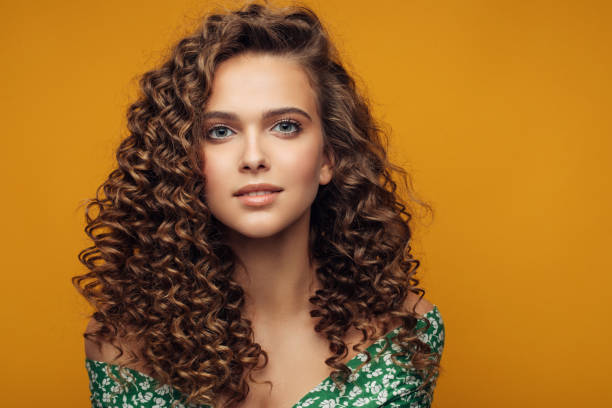 Elegant young woman Elegant young woman curly hair model stock pictures, royalty-free photos & images