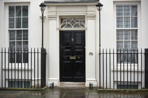 Eleven Downing Street Number 11 Downing Street is the official office of the British Finance Minister (Chancellor of the Exchequer) and is next door to the Prime Minister's residence chancellor stock pictures, royalty-free photos & images