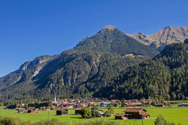 Elmen in the Lech Valley Elmen in the Lech Valley is surrounded by the lovely nature park Tiroler Lech lechtal alps stock pictures, royalty-free photos & images