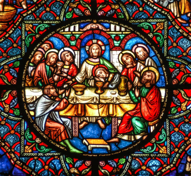 Ely, Cambridgeshire, United Kingdom, July 19th 2007, Ely Cathedral stained glass window depicting the Last Supper with Jesus Christ and the disciples at the table The last supper stained glass window showing Jesus  with the Apostles sitting at the table last supper stock pictures, royalty-free photos & images