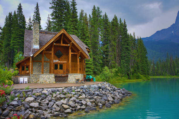 Emerald Lake on a cloudy day with its thawed lake. Summer and fun. Rocky mountain canada (Canadian Rockies). Portrait, fine art. Yoho National Park, British Columbia, Canada: August 3, 2018  log cabin stock pictures, royalty-free photos & images