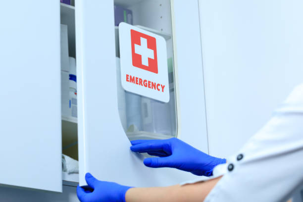 Emergency medical kit with vaccine or drug.  First aid equipment in the laboratory of the medical clinic. Care center for flu, viruses and other diseases in the health system. Treatment offered by the nurse. stock photo