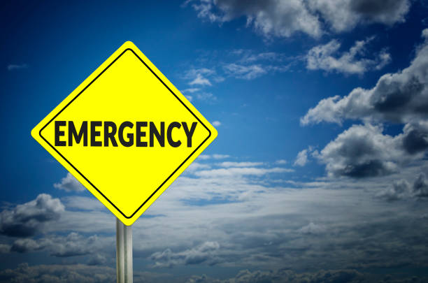 Emergency Emergency road sign with cloudy sky background school emergency stock pictures, royalty-free photos & images