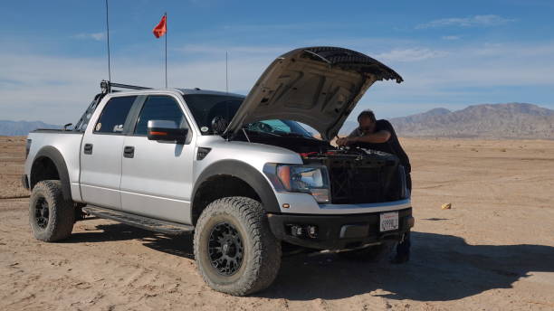 Emergency truck repair in the desert stock photo