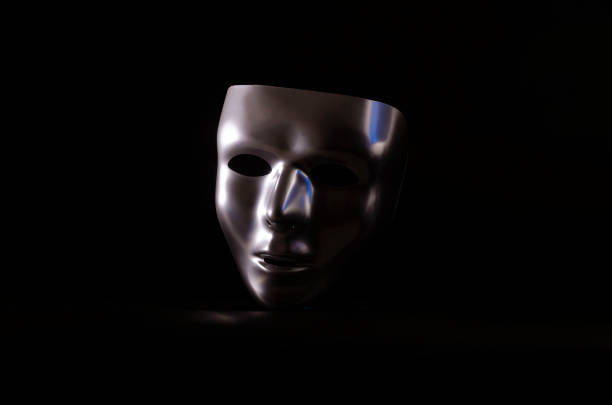 emotionless mask on black background stock photo