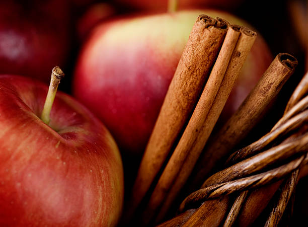 Empire Apples and Cinnamon Sticks  cinnamon stock pictures, royalty-free photos & images