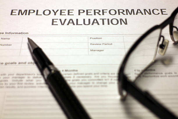 Someone filling out Employee Performance Evaluation.