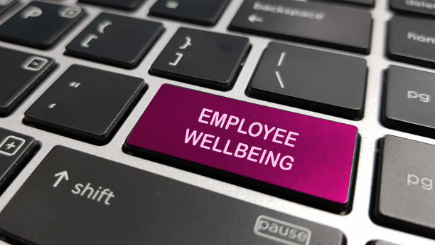 Employee wellbeing and wellness concept using keyboard keys stock photo