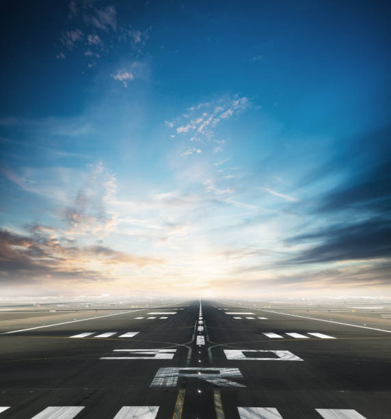 Empty airport runway with dramatic sky Empty asphalt airport runway with dramatic sky. airport runway stock pictures, royalty-free photos & images