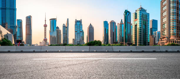 Empty asphalt road and famous architectural landscape skyline in Shanghai stock photo