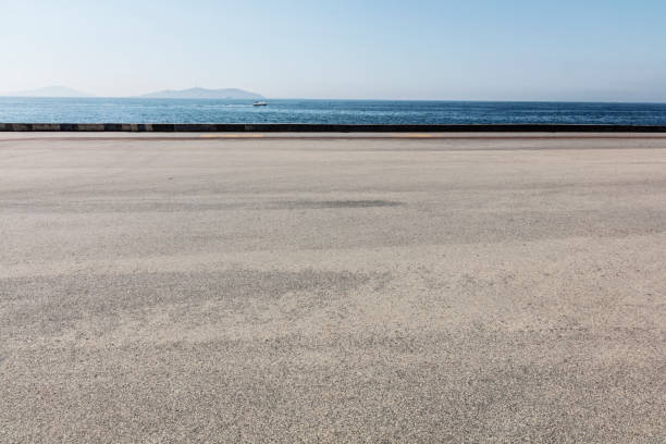 empty asphalt space with seaside view stock photo