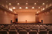 istock Empty auditorium with grey seats and downlights 157334256