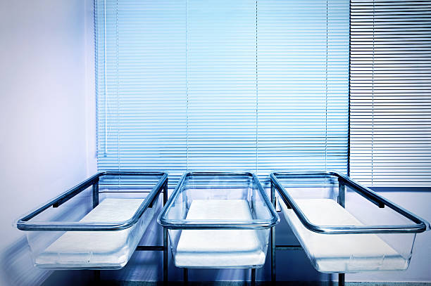 empty baby cots - cradle to cradle stockfoto's en -beelden