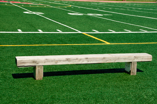 Empty Bench Against A Football Field Stock Photo - Download Image Now -  iStock
